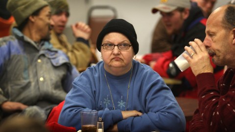 WILMINGTON, OH - JANUARY 29:  People wait to be served at the Sugartree Ministries soup kitchen January 29, 2009 in Wilmington, Ohio. The center has begun serving increased numbers of people, as layoffs in the town skyrocket. The German air shipping company DHL closed down its U.S. domestic shipping service and thousands of job losses in its Wilmington hub are devastating the local economy. (Photo by John Moore/Getty Images)