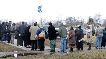 WAYNE, MI - MARCH 11:  People stand in freezing temperatures to attend a jobs fair at the City of Wayne Community Center March 11, 2009 in Wayne, Michigan. The fair was sponsored by "Michigan Works!" a workforce development association that fosters high-quality employment and training programs. Many of those in attendance have been retrained through the State of Michigan's "No Worker Left Behind" program.  (Photo by Bill Pugliano/Getty Images)