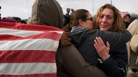 LORDSTOWN, OH - MARCH 06: GM Lordstown workers comfort one another after their last day of work at a rally outside the GM Lordstown plant on March 6, 2019 in Lordstown, Ohio. The sprawling facility was idled today after more than 50 years producing cars and other vehicles, falling victim to changing U.S. auto preferences, according to the company.  (Photo by Jeff Swensen/Getty Images)