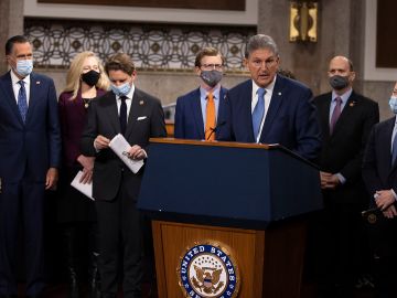 WASHINGTON, DC - DECEMBER 01: Sen. Joe Manchin (D-WV) speaks alongside a bipartisan group of Democrat and Republican members of Congress as they announce a proposal for a Covid-19 relief bill on Capitol Hill on December 01, 2020 in Washington, DC. The roughly $908 billion proposal includes $288 billion in small business aid such as Paycheck Protection Program loans, $160 billion in state and local government relief and $180 billion to fund a $300 per week supplemental unemployment benefit through March, according to a draft framework. (Photo by Tasos Katopodis/Getty Images)