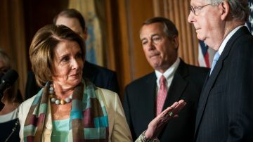 WASHINGTON, DC - APRIL 16:  House Minority Leader Nancy Pelosi (D-CA) motions to Senate Majority Leader Mitch McConnell (R-KY) during the signing of the Medicare Access CHIP Reauthorization Act 2015, H.R. 2, press event at the Capitol on April 16, 2015 in Washington, D.C. H.R. 2, commonly known as "Doc Fix", is  a bipartisan bill to strengthen Medicare and fix its payment formula for doctors. (Photo by Gabriella Demczuk/Getty Images)