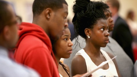 CHICAGO, IL - JUNE 12: Job seekers listen to a recruiter at a job fair on June 12, 2014 in Chicago, Illinois. According to the Department of Labor's latest jobs report unemployment is at 6.3%, the lowest since 2008 when massive layoffs swept through the country. (Photo by Scott Olson/Getty Images)