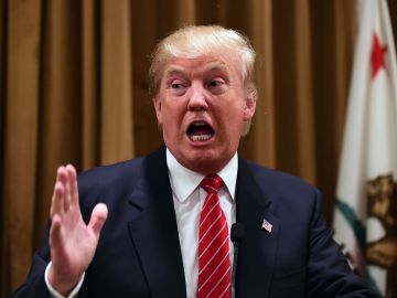Donald Trump gestures at a press briefing where he introduced people whose families were victims of illegal immigrants on July 10, 2015 at the Beverly Wilshire Hotel in Beverly Hills, California, where some shared their stories of the loss of a loved one. The US business magnate Trump, who is running for President in the 2016 presidential elections, angered members of the Latino community with recent comments but says he will win the Latino vote. AFP PHOTO / FREDERIC J. BROWN (Photo by FREDERIC J. BROWN / AFP) (Photo credit should read FREDERIC J. BROWN/AFP via Getty Images)