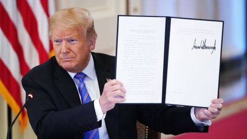 US President Donald Trump holds an executive order on "Continuing the President's National Council for the American Worker and the American Workforce Policy Advisory Board" which he signed during an American Workforce Policy Advisory Board Meeting in the East Room of the White House in Washington, DC on June 26, 2020. (Photo by MANDEL NGAN / AFP) (Photo by MANDEL NGAN/AFP via Getty Images)