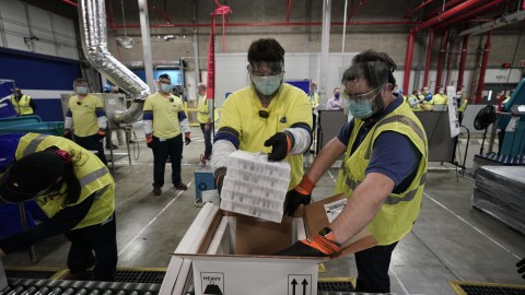 PORTAGE, MICHIGAN - DECEMBER 13: Boxes containing the Pfizer-BioNTech COVID-19 vaccine are prepared to be shipped at the Pfizer Global Supply Kalamazoo manufacturing plant on December 13, 2020 in Portage, Michigan. (Photo by Morry Gash - Pool/Getty Images)