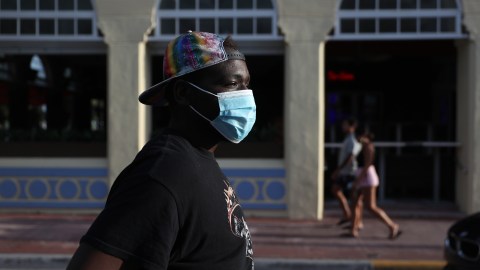 MIAMI BEACH, FLORIDA - MAY 07: Niklaus Salvator walks near the hotel where he used to work on Ocean Drive on May 07, 2020 in Miami Beach, Florida. Mr. Salvator was laid off due to the hotel closing when the coronavirus pandemic hit. He joined millions of people who have seen similar layoffs around the country. The April’s jobs report, which is scheduled to be released Friday, will provide a look into how many jobs were lost last month due to COVID-19. (Photo by Joe Raedle/Getty Images)