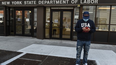 NEW YORK, NY - MAY 07: Luis Mora stands in front of the closed offices of the New York State Department of Labor on May 7, 2020 in the Brooklyn borough in New York City. 3.2 million Americans have filed for unemployment insurance this week bringing the total number of workers who have applied for aid to 33 million in the past two months. (Photo by Stephanie Keith/Getty Images)