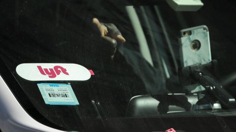 NEW YORK, NY - MARCH 19: A Lyft logo is displayed on a vehicle driving through Times Square, March 19, 2019 in New York City. Lyft, the popular ride-hailing service and competitor to Uber, is planning its initial public offering (IPO) on the NASDAQ stock exchange in the coming weeks. Lyft is projecting investors will buy the stock for between $62 and $68 per share, with the company expecting to raise over $2 billion through the sale of stock. (Photo by Drew Angerer/Getty Images)