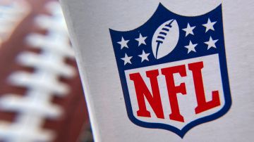 The NFL logo is seen on a football packaging in Los Angeles on August 24, 2020. - A rash of COVID-19 results that forced multiple NFL teams to adjust their weekend training plans were false positives due to "isolated contamination during test preparation," the lab responsible said August 24, 2020. (Photo by Chris DELMAS / AFP) (Photo by CHRIS DELMAS/AFP via Getty Images)