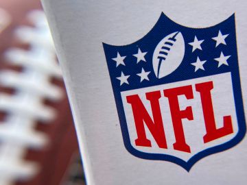 The NFL logo is seen on a football packaging in Los Angeles on August 24, 2020. - A rash of COVID-19 results that forced multiple NFL teams to adjust their weekend training plans were false positives due to "isolated contamination during test preparation," the lab responsible said August 24, 2020. (Photo by Chris DELMAS / AFP) (Photo by CHRIS DELMAS/AFP via Getty Images)