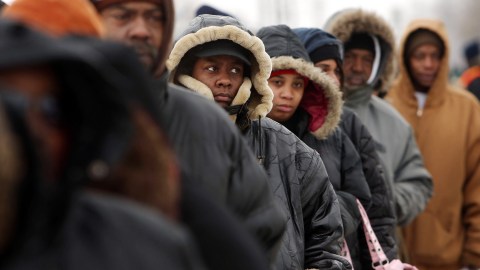 DETROIT - DECEMBER 18:  People wait in a several block line to receive gifts of food, personal care and household items and toys at the A Miracle in Motown event, part of the nationwide  program to help working poor and disadvantaged families December 18, 2008 in Detroit, Michigan.  About 5,000 families are expected to receive enough food at the event to supplement meals for a family of four for a week. A Miracle in Motown is sponsored by The National Basketball Players Association (NBPA) along with Feed The Children, Great Redeemer Christian Church and The Bing Group. An estimated one in three Detroiters lives in poverty, making the city the poorest large city in America.  (Photo by Spencer Platt/Getty Images)