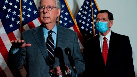 US Senate Minority Leader Mitch McConnell (L), R-KY, speaks with US Senator John Barrasso (R), R-WY, after the Republican Policy Luncheon on Capitol Hill in Washington, DC, on January 26, 2021.