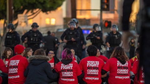 LOS ANGELES, CA - NOVEMBER 29: Police surround striking McDonald's restaurant employees sitting in an intersection after walking off the job to demand a $15 per hour wage and union rights during nationwide 'Fight for $15 Day of Disruption' protests on November 29, 2016 in Los Angeles, California. Police made 40 peaceful arrests. Protest rallies are expected in nearly 20 airports and outside restaurants in numerous cities, according to organizers. (Photo by David McNew/Getty Images)