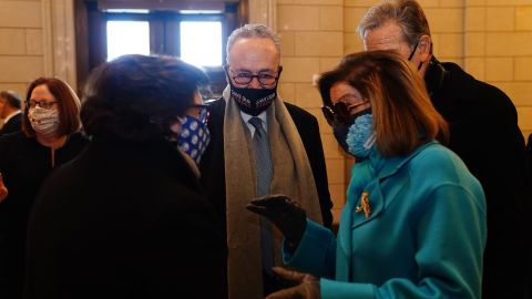 WASHINGTON, DC - JANUARY 20: Speaker of the House Nancy Pelosi (R) and Senate Minority Leader Chuck Schumer (2L) before President-elect Joe Biden arrives at the East Front of the US Capitol for his inauguration ceremony to be the 46th President of the United States on January 20, 2021 in Washington, DC. During today's inauguration ceremony Joe Biden becomes the 46th president of the United States. (Photo by Jim Lo Scalzo-Pool/Getty Images)