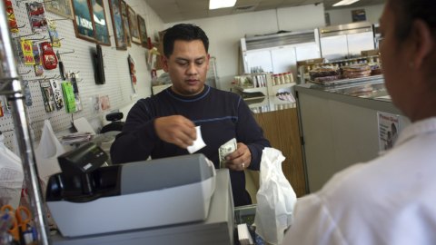 FARMERS BRANCH, TX - NOVEMBER 13:  Samuel Rodriguez, originally from El Salvador, works in the Hispanic oriented store Tienda Santa Rosa November 13, 2006 in Farmers Branch, Texas. He said he hoped that the proposed anti-immigration legislation proposed by the city council there will not pass because it would be bad for the community and bad for business. Later in the evening, council members unanimously voted to pass the legislation that would make English the official language of the city and approving fines for landlords and businesses who do business with illegal immigrants. (Photo by Brian Harkin/Getty Images)