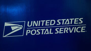 NEW YORK, NY - SEPTEMBER 25:  Signage for the United States Post Office (USPS) is seen on September 25, 2013 in New York City. The USPS announced today that they're considering raising the price of stamps by 3 cents.  (Photo by Andrew Burton/Getty Images)