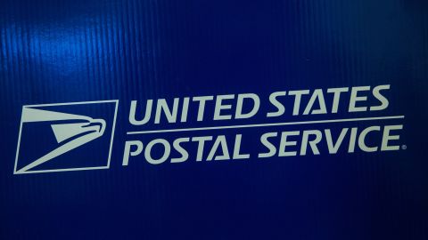 NEW YORK, NY - SEPTEMBER 25: Signage for the United States Post Office (USPS) is seen on September 25, 2013 in New York City. The USPS announced today that they're considering raising the price of stamps by 3 cents. (Photo by Andrew Burton/Getty Images)