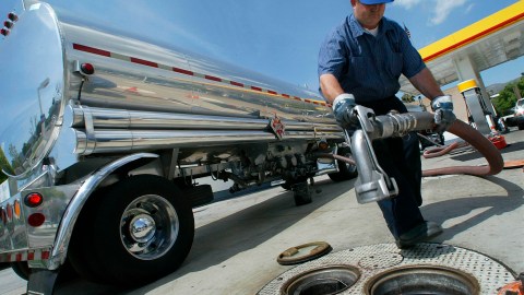 Gasoline delivery truck driver Robert Clark prepares to fill the underground gas tanks at a Shell station in Glendale California, 26 March, 2004. Red-hot oil prices cooled slightly on 02 June 2004, after OPEC kingpin Saudi Arabia promised to boost output to bring down record high prices, though traders remained sceptical of its chances of success. Saudi Oil Minister Ali al-Nuaimi said ahead of an OPEC meeting in Beirut the oil-rich kingdom was "fully ready" to increase oil production in an effort to return prices to OPEC's target range of 22-28 dollars a barrel. Organization of Petroleum Exporting Countries(OPEC) ministers gathering in the Lebanese capital for a formal meeting on 03 June are under heavy pressure from the United States and European nations to open up the taps. AFP PHOTO / Robyn BECK (Photo credit should read ROBYN BECK/AFP via Getty Images)