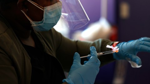 SANTA CLARA, CALIFORNIA - APRIL 08: A nurse administers a COVID-19 vaccination during a vaccination clinic for Special Olympics athletes, coaches and family members at Levi's Stadium on April 08, 2021 in Santa Clara, California. The San Francisco 49ers partnered with the County of Santa Clara Health System and the Santa Clara County Board of Supervisors to provide COVID-19 vaccines to Special Olympics athletes and their families. People with intellectual disabilities are 2.5 times more likely to contract COVID-19 than the general population and six times more likely to die from COVID-19 than the general population. (Photo by Justin Sullivan/Getty Images)