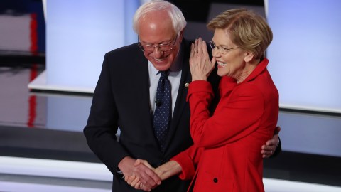 DETROIT, MICHIGAN - JULY 30: Democratic presidential candidate Sen. Bernie Sanders (I-VT) (R) and Sen. Elizabeth Warren (D-MA) greet each other at the start of the Democratic Presidential Debate at the Fox Theatre July 30, 2019 in Detroit, Michigan. 20 Democratic presidential candidates were split into two groups of 10 to take part in the debate sponsored by CNN held over two nights at Detroit’s Fox Theatre. (Photo by Justin Sullivan/Getty Images)