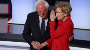 DETROIT, MICHIGAN - JULY 30: Democratic presidential candidate Sen. Bernie Sanders (I-VT) (R) and Sen. Elizabeth Warren (D-MA) greet each other at the start of the Democratic Presidential Debate at the Fox Theatre July 30, 2019 in Detroit, Michigan. 20 Democratic presidential candidates were split into two groups of 10 to take part in the debate sponsored by CNN held over two nights at Detroit’s Fox Theatre.  (Photo by Justin Sullivan/Getty Images)