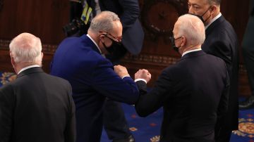 WASHINGTON, DC - APRIL 28: U.S. President Joe Biden greets Senate Majority leader Chuck Schumer (D-NY) before addressing a joint session of congress in the House chamber of the U.S. Capitol April 28, 2021 in Washington, DC. On the eve of his 100th day in office, Biden spoke about his plan to revive America’s economy and health as it continues to recover from a devastating pandemic. He delivered his speech before 200 invited lawmakers and other government officials instead of the normal 1600 guests because of the ongoing COVID-19 pandemic. (Photo by Chip Somodevilla/Getty Images)