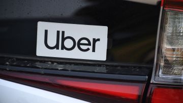 An Uber sticker is seen on a car at the start of a protest by ride share drivers on August 20, 2020 in Los Angeles, California. - Rideshare service rivals Uber and Lyft were given a temporary reprieve on August 20 from having to reclassify drivers as employees in their home state of California by August 21. (Photo by Robyn Beck / AFP) (Photo by ROBYN BECK/AFP via Getty Images)