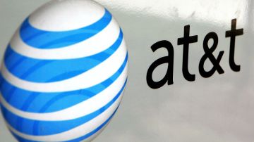 PARK RIDGE, IL - JULY 25:  An AT&T logo is displayed on an AT&T truck July 25, 2006 in Park Ridge, Illinois. AT&T announced July 25 that its profits climbed 81 percent with the growth in wireless communications and broadband service. (Photo by Tim Boyle/Getty Images)