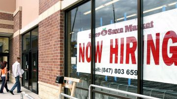 DES PLAINES, IL - AUGUST 05:  Two job applicants, with their applications in hand, walk past a Now Hiring sign into a new grocery store under construction August 5, 2005 in Des Plaines, Illinois. In a report released today, the U.S. Labor Department reported that US employers added 207,000 jobs in July. (Photo by Tim Boyle/Getty Images)