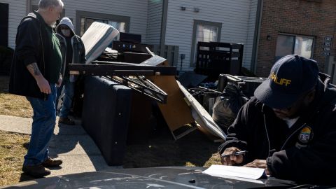 COLUMBUS, OH - MARCH 03: Deputy Service Bailiff Michael Taylor signs a writ of eviction in the unincorporated community of Galloway on March 3, 2021 west of Columbus, Ohio. Taylor says that he usually waits days past the deadline to clear out properties so there is not a confrontation.  (Photo by Stephen Zenner/Getty Images)