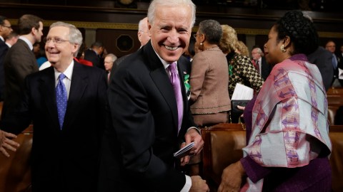 WASHINGTON, DC - FEBRUARY 12: U.S. Vice President Joe Biden (C), Senate Minority Leader Mitch McConnell (R-KY) (L), Rep. Shelia Jackson Lee (D-TX) (R) and others arrive on Capitol Hill on February 12, 2013 in Washington, D.C. Facing a divided Congress, Obama is expected to focus his speech on new initiatives designed to stimulate the U.S. economy. (Photo by Charles Dharapak-Pool/Getty Images)
