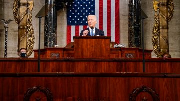 WASHINGTON, DC - APRIL 28: U.S. President Joe Biden addresses a joint session of Congress as Vice President Kamala Harris (L) and Speaker of the House U.S. Rep. Nancy Pelosi (D-CA) (R) look on in the House chamber of the U.S. Capitol April 28, 2021 in Washington, DC. On the eve of his 100th day in office, Biden spoke about his plan to revive America’s economy and health as it continues to recover from a devastating pandemic. He delivered his speech before 200 invited lawmakers and other government officials instead of the normal 1600 guests because of the ongoing COVID-19 pandemic.  (Photo by Melina Mara-Pool/Getty Images)