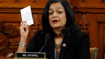 WASHINGTON, DC - DECEMBER 13: Rep. Pramila Jayapal, D-Wash., holds up a copy of the U.S. Constitution as she votes yes to the second article of impeachment as the House Judiciary Committee holds a public hearing to vote on the two articles of impeachment against U.S. President Donald Trump in the Longworth House Office Building on Capitol Hill December 13, 2019 in Washington, DC. The articles charge Trump with abuse of power and obstruction of Congress. House Democrats claim that Trump posed a 'clear and present danger' to national security and the 2020 election based on his dealings with Ukraine. (Photo by Patrick Semansky-Pool/Getty Images)