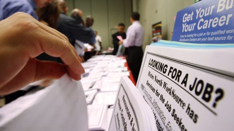 PASADENA, CA - MAY 14: Job seekers look over job opening fliers at the WorkSource exhibit, a collaborative effort by governmental agencies to offer jobs and job training resources at the Greater Los Angeles Career Expo at the Pasadena Convention Center on May 14, 2009 in Pasadena, California. Nineteen exhibitors offer job and educational opportunities as well as advice from the Board of Equalization at the event that is open to the general public. (Photo by David McNew/Getty Images)