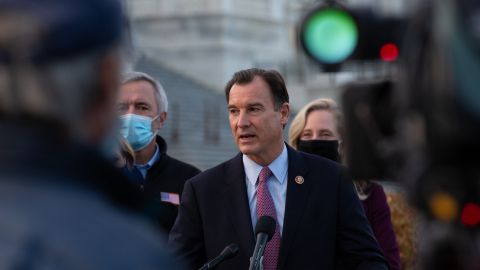 WASHINGTON, DC - DECEMBER 21: Rep. Tom Suozzi (D-NY) speaks at the podium standing with members of the Problem Solvers Caucus to praise the forthcoming passage of the bipartisan emergency COVID-19 relief bill in a press conference outside the US Capitol on December 21, 2020 in Washington, DC. The bipartisan group took credit for leading the negotiations that led to a deal that will include direct payments, extended unemployment benefits and small business loans. (Photo by Cheriss May/Getty Images)