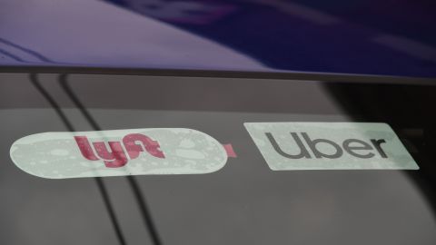 Rideshare drivers demonstrate against rideshare companies Uber and Lyft during a car caravan protest on August 6, 2020 in Los Angeles. - The drivers, organized by the Mobile Workers Alliance and Rideshare Drivers United unions, say Uber and Lyft's are pushing a "deceptive" November ballot initiative, which, if passed, they claim would "rewrite labor law" and turn app-based drivers into independent contractors, exempting companies such as Lyft and Uber from standard wage and hour restrictions. (Photo by Robyn Beck / AFP) (Photo by ROBYN BECK/AFP via Getty Images)