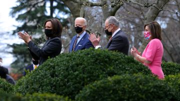 WASHINGTON, DC - MARCH 12: (L-R) U.S. Vice President Kamala Harris, U.S. President Joe Biden U.S. Senate Majority Leader Sen. Chuck Schumer (D-NY) and Speaker of the House Rep. Nancy Pelosi (D-CA)  attend an event on the American Rescue Plan in the Rose Garden of the White House on March 12, 2021 in Washington, DC. President Biden signed the $1.9 trillion American Rescue Plan Act into law that will send aid to millions of Americans struggling from the COVID-19 pandemic.  (Photo by Alex Wong/Getty Images)