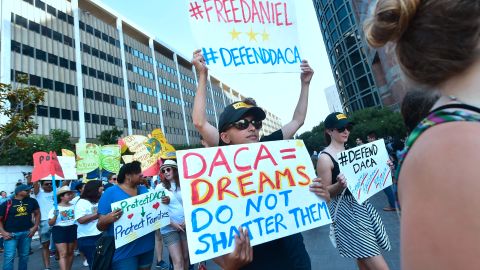 Young immigrants and supporters walk holding signs during a rally in support of Deferred Action for Childhood Arrivals (DACA) in Los Angeles, California on September 1, 2017.
A decision is expected in coming days on whether US President Trump will end the program by his predecessor, former President Obama, on DACA which has protected some 800,000 undocumented immigrants, also known as Dreamers, since 2012. / AFP PHOTO / FREDERIC J. BROWN (Photo credit should read FREDERIC J. BROWN/AFP via Getty Images)