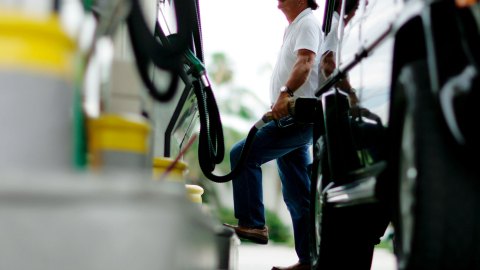 MIAMI - JULY 18: Charlie Sanchez fills his tank at a gas station July 18, 2006 in Miami, Florida. Across the country, the average price of regular unleaded gasoline is now $2.98 a gallon, according to American Automobile Association. (Photo by Joe Raedle/Getty Images)