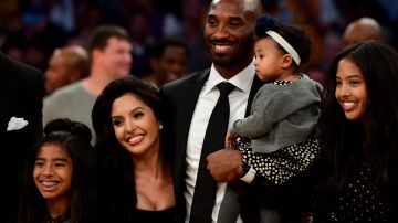 LOS ANGELES, CA - DECEMBER 18:  Kobe Bryant poses with his family at halftime after both his #8 and #24 Los Angeles Lakers jerseys are retired at Staples Center on December 18, 2017 in Los Angeles, California. NOTE TO USER: User expressly acknowledges and agrees that, by downloading and or using this photograph, User is consenting to the terms and conditions of the Getty Images License Agreement.  (Photo by Harry How/Getty Images)