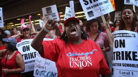 CHICAGO, IL - SEPTEMBER 11:  Chicago public school teachers and their supporters picket in front of the Chicago Public Schools (CPS) headquarters on September 11, 2012 in Chicago, Illinois. More than 26,000 teachers and support staff walked off their jobs yesterday after the Chicago Teachers Union failed to reach an agreement with the city on compensation, benefits and job security. With about 350,000 students, the Chicago school district is the third largest in the United States.  (Photo by Scott Olson/Getty Images)