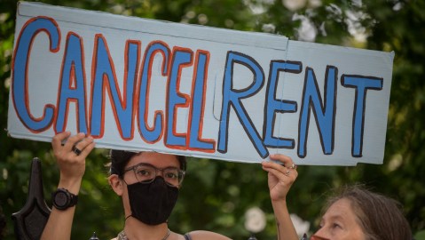 TOPSHOT - Demonstrators attend a rally calling for an extension of the state's eviction ban until 2022 and the cancellation of rent, in lower Manhattan, New York city on August 11, 2021. - Under pressure from progressive Democrats, US health authorities declared a new moratorium on evictions until October in much of the country, citing public health risks posed by the pandemic. (Photo by Ed JONES / AFP) (Photo by ED JONES/AFP via Getty Images)
