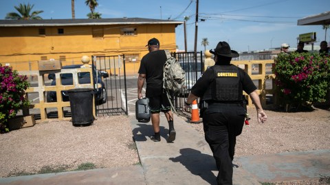 PHOENIX, ARIZONA - OCTOBER 07: Maricopa County constable Darlene Martinez evicts a tenant on October 7, 2020 in Phoenix, Arizona. Thousands of court-ordered evictions continue nationwide despite a Centers for Disease Control (CDC) moratorium for renters impacted by the coronavirus pandemic. Although state and county officials say they have tried to educate the public on the protections, many renters remain unaware and fail to complete the necessary forms to remain in their homes. In many cases landlords have worked out more flexible payment plans with vulnerable tenants, although these temporary solutions have become fraught as the pandemic drags on. With millions of Americans still unemployed due to the pandemic, federal rental assistance proposals remain gridlocked in Congress. The expiry of the CDC moratorium at year's end looms large, as renters and landlord face a potential tsunami of evictions and foreclosures nationwide. (Photo by John Moore/Getty Images)