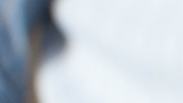 A businessman is buying online using his mobile phone and credit card