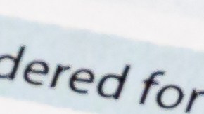 Foto de un formulario con varios billetes encima