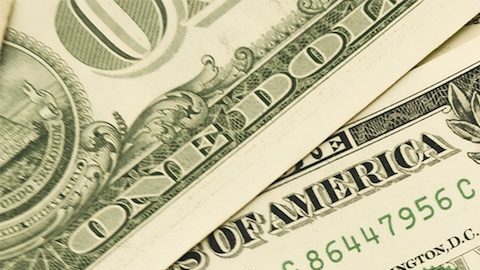 Montón de billetes de $1 dólar estadounidense.