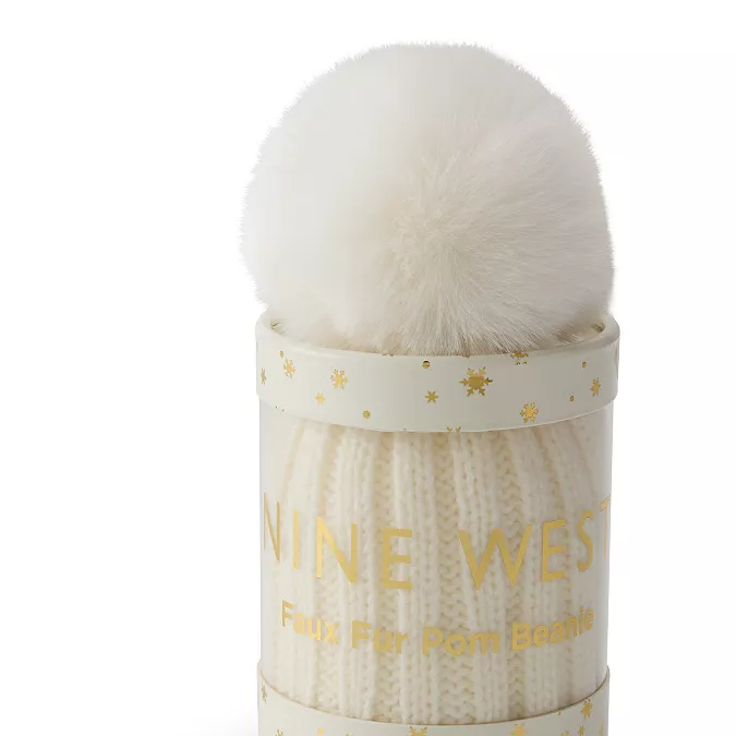 Tubo de regalo de gorro de punto con pompón de piel sintética de Nine West para mujer.